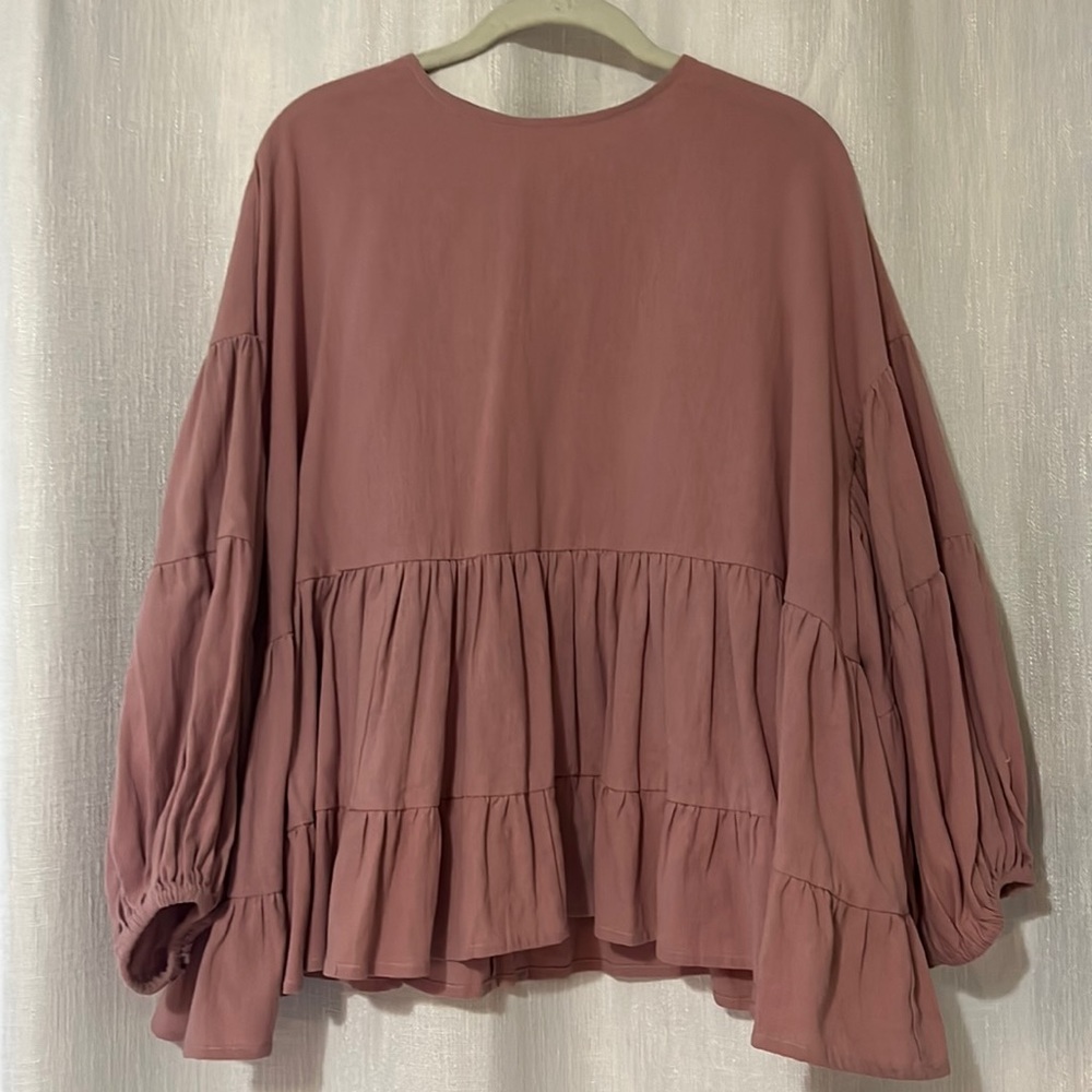Pink longsleeve peplum top.